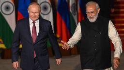 India's Prime Minister Narendra Modi (R) greets Russian President Vladimir Putin before a meeting at Hyderabad House in New Delhi on December 6, 2021. (Photo by Money SHARMA / AFP) (Photo by MONEY SHARMA/AFP via Getty Images)