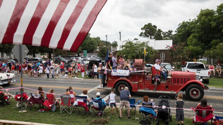 Spectators watch the 168th annual Round Top Fourth of July Parade in Round Top, Texas on July 4, 2018. The Round Top community's Fourth of July celebration started in 1851 and is known as the longest running Fourth of July celebration west of the Mississippi.